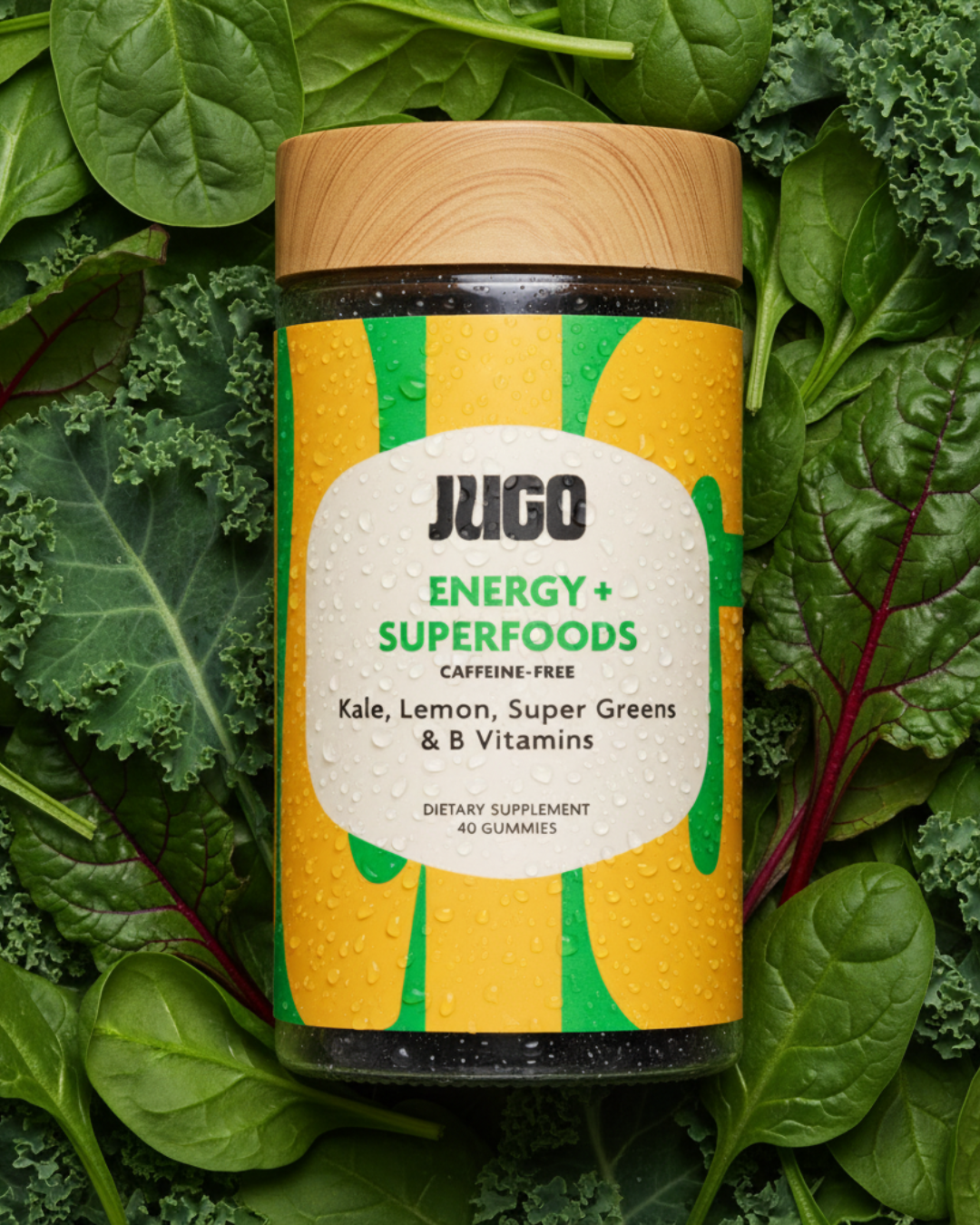Studio product shot of a Jugo Energy Superfoods bottle resting on a bed of leafy green vegetables.