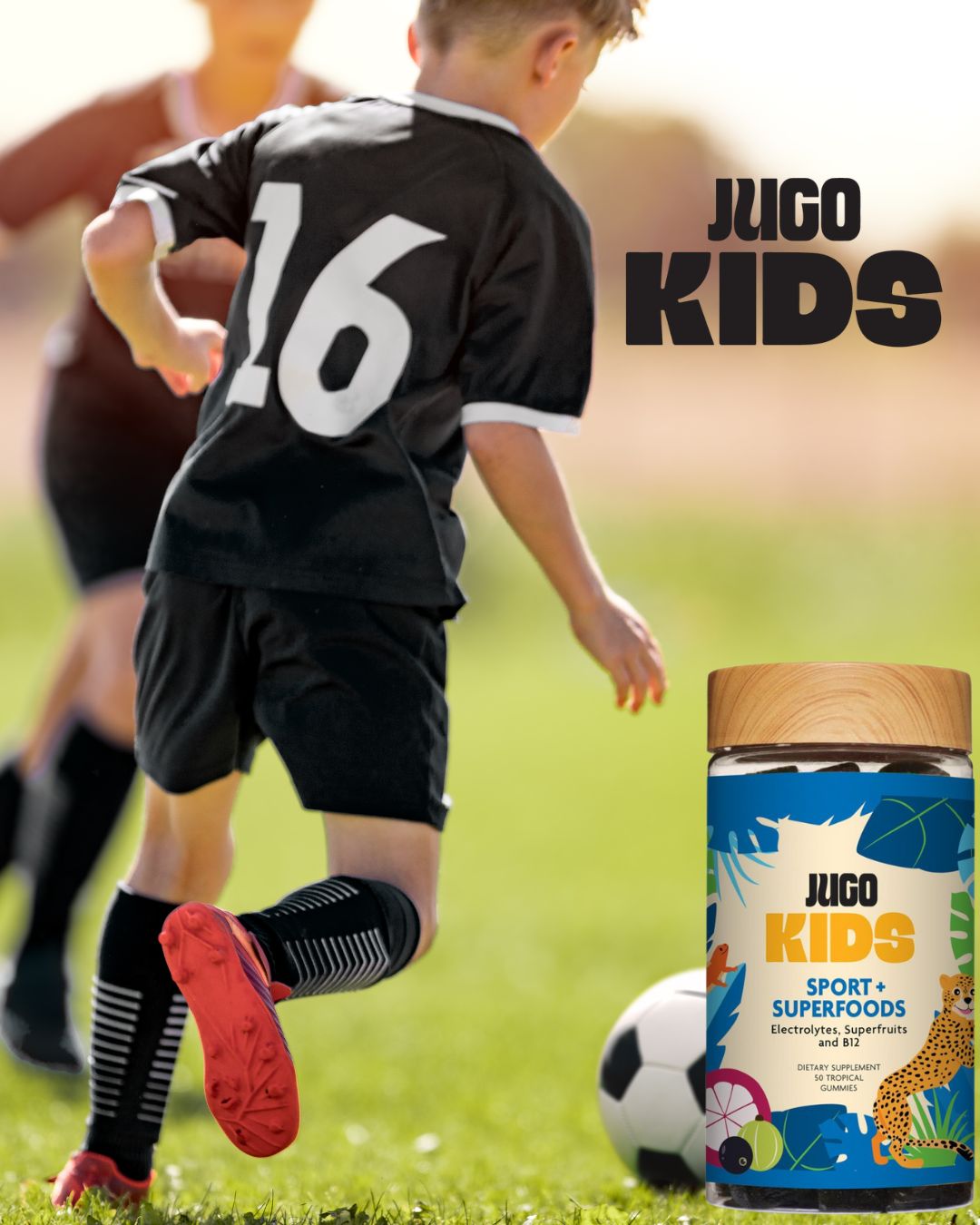 Action lifestyle photo of a child playing soccer while wearing a Jugo Kids jersey, with a Jugo Kids Sport Superfoods bottle nearby.