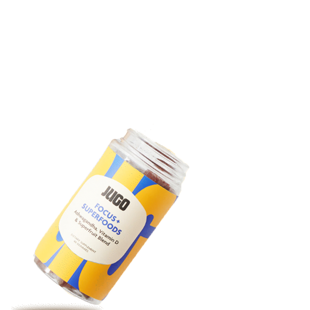 Animated-style image of a tilted Jugo Focus Superfoods bottle on a black background with gummies spilling out.