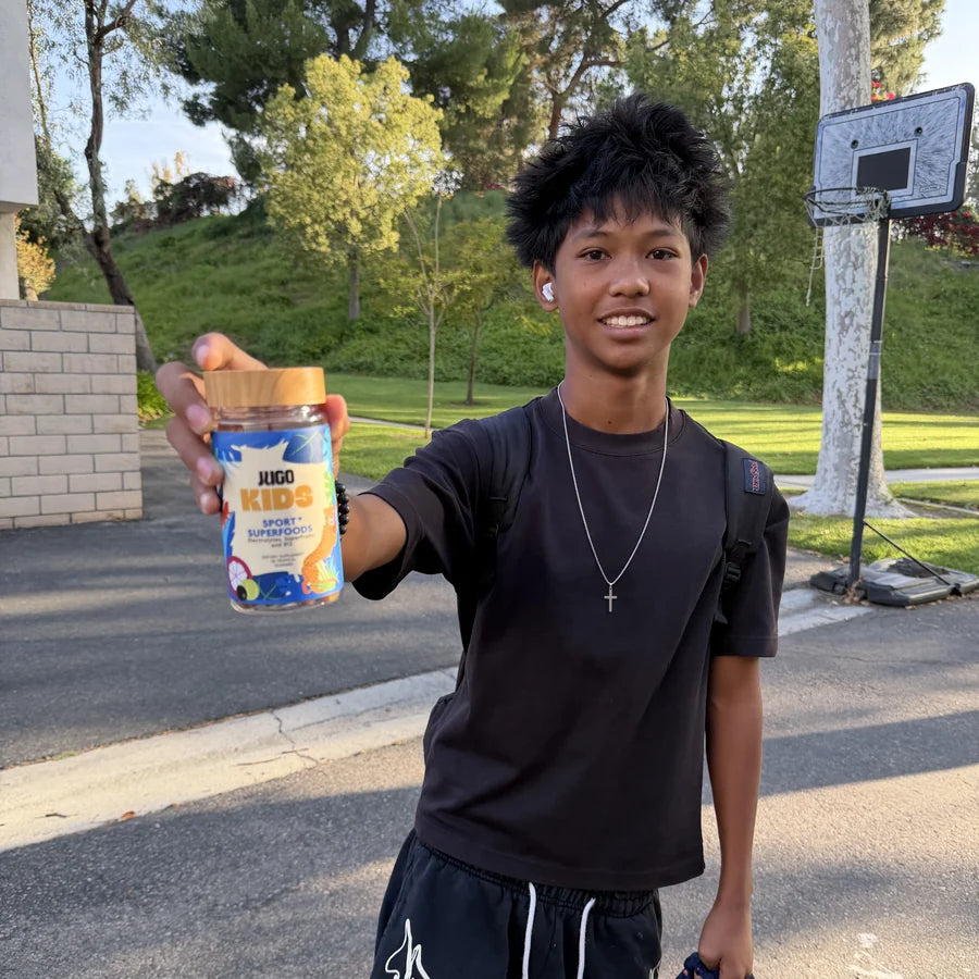 Child with their JUGO Kids gummies
